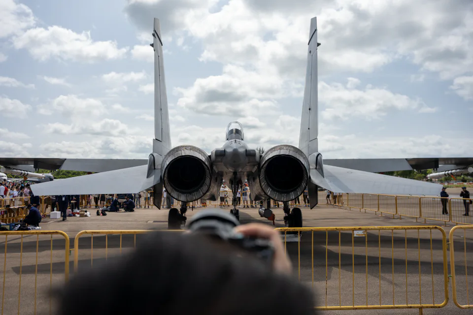 Rear view of a twin-engine fighter on static display